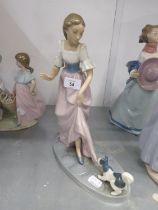 NAO MODEL OF A YOUNG LADY WITH A DOG PULLING HER HEM
