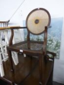 MAHOGANY BERGERE OPEN ARMCHAIR WITH CANED CIRCULAR BACK, THE CANE SEAT AS FOUND