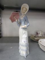 LLADRO FIGURE OF A LADY IN LONG DRESS HOLDING A PARASOL, 13in (33cm) high