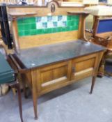 ARTS & CRAFTS STYLE OAK CUPBOARD WASHSTAND WITH RAISED GREEN TILED BACK