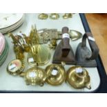 TEN SMALL BRASS ORNAMENTS; TWO CHAMBER CANDLESTICKS, TWO FLAT IRONS, ETC. (APPROXIMATELY 18 PIECES)