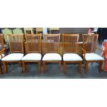 A SET OF SIX CONTINENTAL HARDWOOD DINING CHAIRS, INCLUDING A PAIR OF CARVER’S ARMCHAIRS, WITH BAMBOO