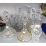 TEN CUT GLASS DECANTERS AND STOPPERS, including A PAIR, TWO SHIP’S DECANTERS and TWO SQUARE
