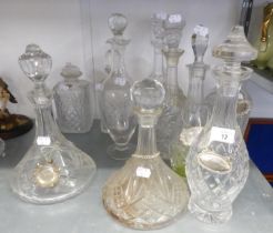 TEN CUT GLASS DECANTERS AND STOPPERS, including A PAIR, TWO SHIP’S DECANTERS and TWO SQUARE