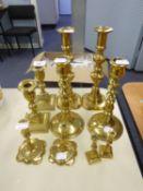THREE PAIRS OF BRASS CANDLESTICKS AND TWO PAIRS OF BRASS MINIATURE CANDLESTICKS