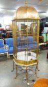 TWENTIETH CENTURY COPPER AND GILT BRASS LARGE FLOOR STANDING BIRD CAGE, of octagonal form with