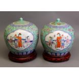 PAIR OF CHINESE REPUBLIC PERIOD PORCELAIN SWOLLEN ORBICULAR JARS WITH COVERS, all-over polychrome