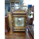 EDWARDIAN CARVED OAK MANTEL CLOCK