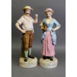 PAIR OF ROBERTS & LEADBETTER TINTED BISQUE FIGURES, modelled as a maid and her companion, 17 ½” (