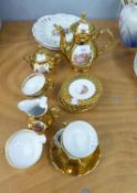 BAVARIAN CHINA COFFEE SERVICE OF FIFTEEN PIECES, PICTORIAL AND GILT DECORATED AND THREE FRUIT