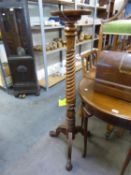 MAHOGANY TALL TORCHERE STAND, WITH CIRCULAR TOP, SPIRALLY LOBED COLUMN, ON TRIPOD SUPPORTS, CLAW AND