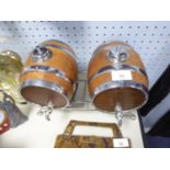 PAIR OF CHROME BOUND COOPERED OAK SMALL BARREL SHAPED DECANTERS ON STAND