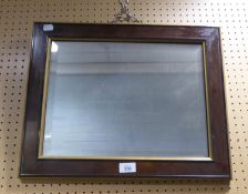 A SMALL OBLONG BEVELLED EDGE WALL MIRROR, IN MAHOGANY AND PARCEL GILT FRAME, 16” X 20” OVERALL