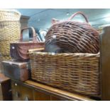 AN OBLONG TWO HANDLE WICKER LOG BASKET, A CIRCULAR LOG BASKET AND TWO WICKER SHOPPING BASKETS AND