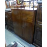 A GENT’S CIRCA 1960'S MAHOGANY SMALL COMPACT WARDROBE, PART OF TOP HINGED TO REVEAL MIRROR AND