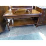 MAHOGANY OBLONG TWO TIER COFFEE TABLE, ON FOUR TURNED AND FLUTED TAPERING LEGS