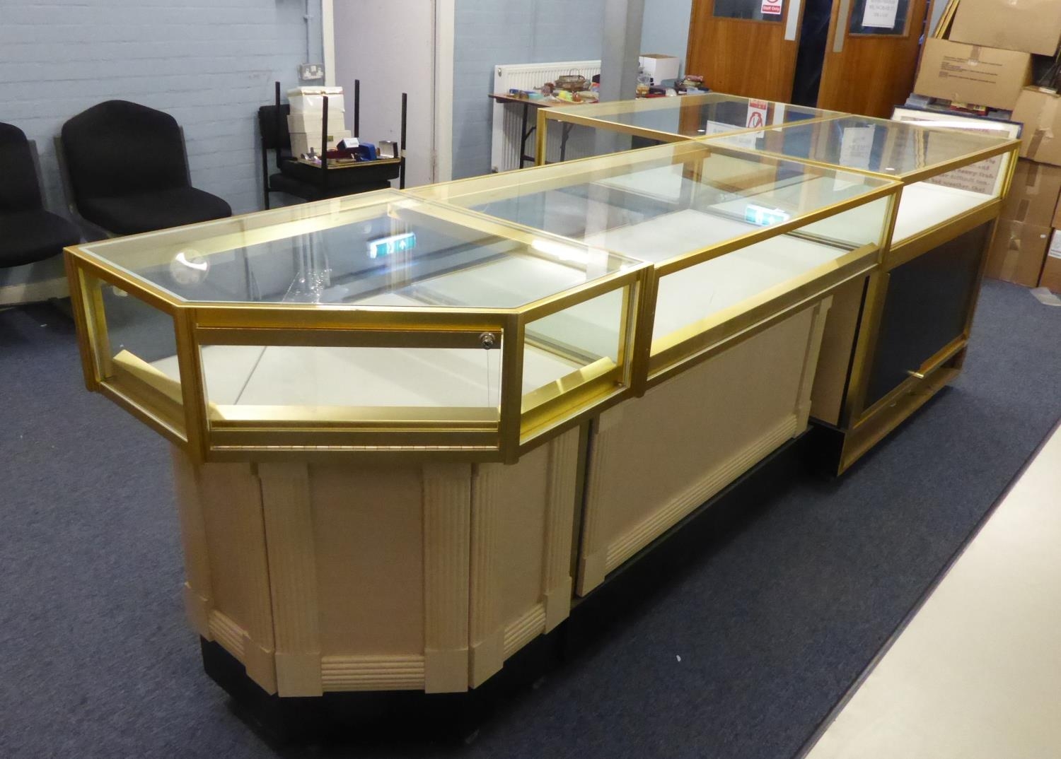 A SET  OF THREE GLASS TOP AND SIDE DISPLAY/JEWELLERY SHOP DISPLAY CABINETS AND A MATCHING CORNER
