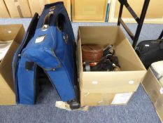 A BLUE CANVAS FOLD-OUT DRESS SUITCASE, ON WHEELS AND A QUANTITY OF LADIES BELTS