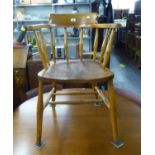 BEECH WOOD TUB SHAPED DESK CHAIR, WITH SPINDLE RAILS AND ELM WOOD SADDLE SEAT, ON H STRETCHER