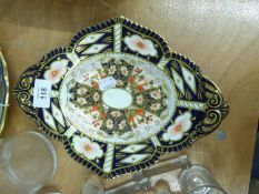 ROYAL CROWN DERBY IMARI PAINTED TWO HANDLED OVAL DISH, WITH BROAD BORDER, RAISED ON FOUR TAB FEET,