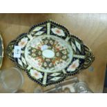 ROYAL CROWN DERBY IMARI PAINTED TWO HANDLED OVAL DISH, WITH BROAD BORDER, RAISED ON FOUR TAB FEET,