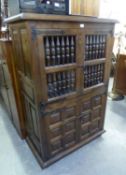 20TH CENTURY MIDDLE EASTERN DESIGN STAINED WOOD STORAGE/FOOD CABINET, THE OPEN WORK UPPER DOORS WITH