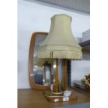 CIRCA 1960S' OAK AND GLASS PANEL TABLE LAMP AND SHADE and a 1960's ROUNDED OBLONG WALL MIRROR (2)