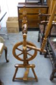 A REPRODUCTION HARDWOOD SPINNING WHEEL