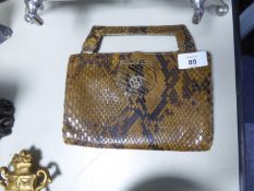 LADY’S SNAKE SKIN HAND BAG, with short handle and silk lined interior