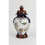 MODERN ORIENTAL PORCELAIN VASE AND COVER, of ovoid form with pointed finial to the domed cover,