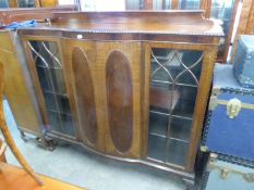 A LARGE MAHOGANY BOW FRONTED DISPLAY CABINET, WITH LEDGE BACK, TWO CENTRAL BOWED PANEL DOORS FLANKED