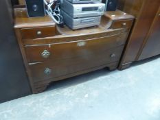 OAK WARDROBE AND AN OAK CHEST OF FOUR LONG DRAWERS AND MATCHING SUNK CENTRE DRESSING TABLE