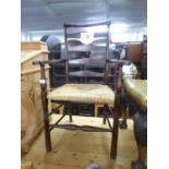 MODERN ELM LADDER BACK OPEN ARMCHAIR, WITH RUSH SEAT, ON POST SUPPORTS