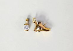9ct GOLD CHARM IN THE FORM OF A BOOT, the hinge-opening to reveal a bride and groom, 2.3gms and a