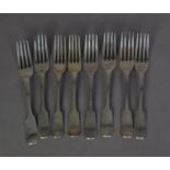 MATCHED SET OF EIGHT LATE GEORGE III SILVER FIDDLE PATTERN CRESTED TABLE FORKS, London 1819, 18 oz
