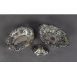 TWO LATE VICTORIAN PIERCED SILVER OBLONG BON BON DISHES, one of pedestal form, base detached, both