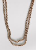 LONG, ROLLED GOLD CONTINUOUS GUARD CHAIN, with belcher pattern links, approximately 62in (158cm)