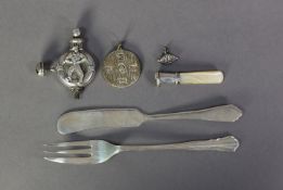 GEORGE V CHILD’S SILVER RATTLE, embossed with a sailor and life belt, with two pendant bells, a/f,