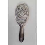 CHINESE EMBOSSED SILVER COLOURED METAL CLAD LADY’S HAND MIRROR, of typical form with oval, bevel