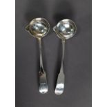 MATCHED PAIR OF GEORGE III IRISH SILVER FIDDLE PATTERN CRESTED SAUCE LADLES with pouring lips by