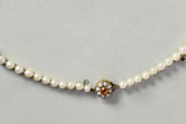 SINGLE STRAND NECKLACE OF 72 GRADUATED CULTURED PEARLS, having 9ct gold circular clasp set with 8