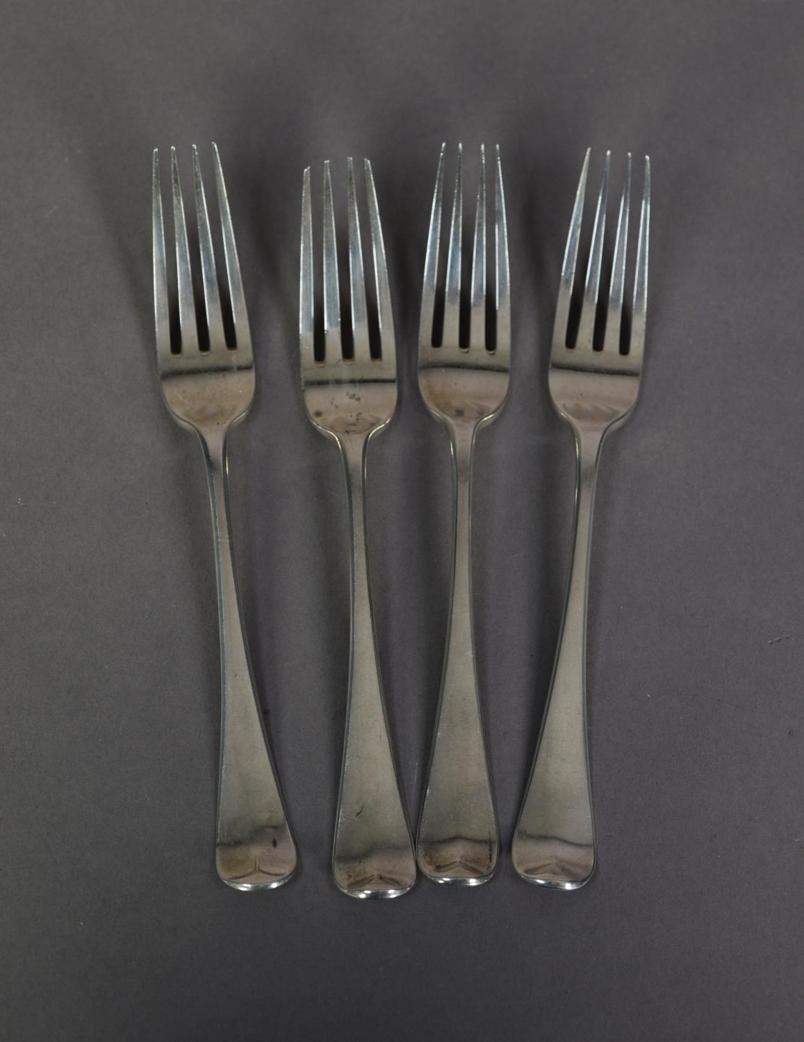 SET OF FOUR GEORGE III SILVER OLD ENGLISH PATTERN TABLE FORKS engraved with cursive initials, by