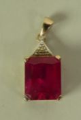 9ct GOLD SMALL PENDANT set with a square cut ruby, 10mm, 2.6gms