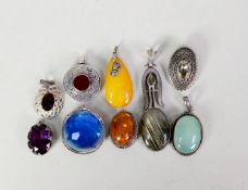 YELLOW AMBER TEAR DROP SHAPE PENDANT with silver mount; a small OVAL AMBER BROOCH, with