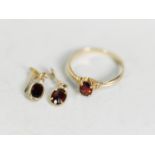 9ct GOLD RING with an oval garnet in a four claw setting and a pair of MATCHING PIN EARRINGS (no