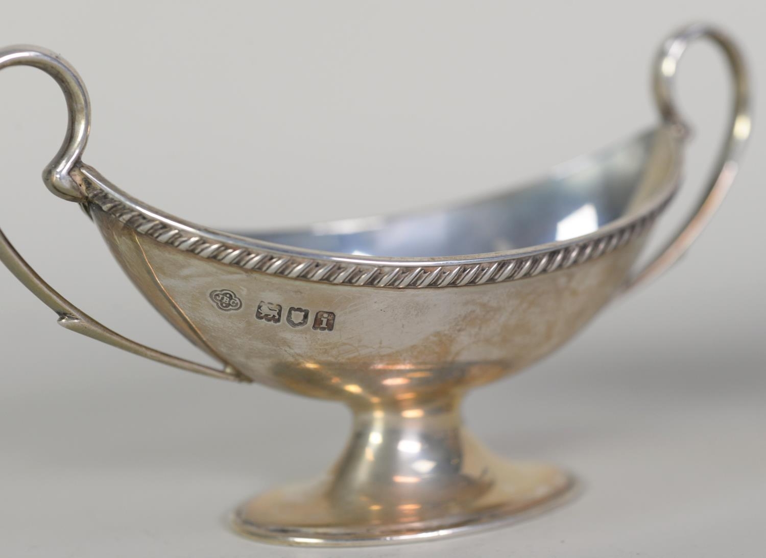 EDWARD VII PAIR OF SILVER TWO HANDLED OPEN SALTS, each of boat shaped pedestal urn form with high - Image 2 of 2