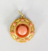 VICTORIAN GOLD COLOUR METAL (no carat mark) CORAL SET CIRCULAR PENDANT LOCKET with vacant locket