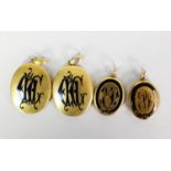 PAIR OF MID VICTORIAN GOLD COLOUR METAL (no carat marks) OVAL MOURNING HAIR LOCKETS each with a