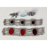 TWO MIDDLE EASTERN FILIGREE SILVER SIX-STRAND BRACELETS, each with three large filigree panels