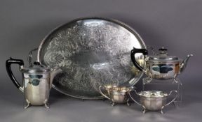 FOUR PIECE ELECTROPLATED TEA SET, of oval, panelled form with black angular scroll handles and